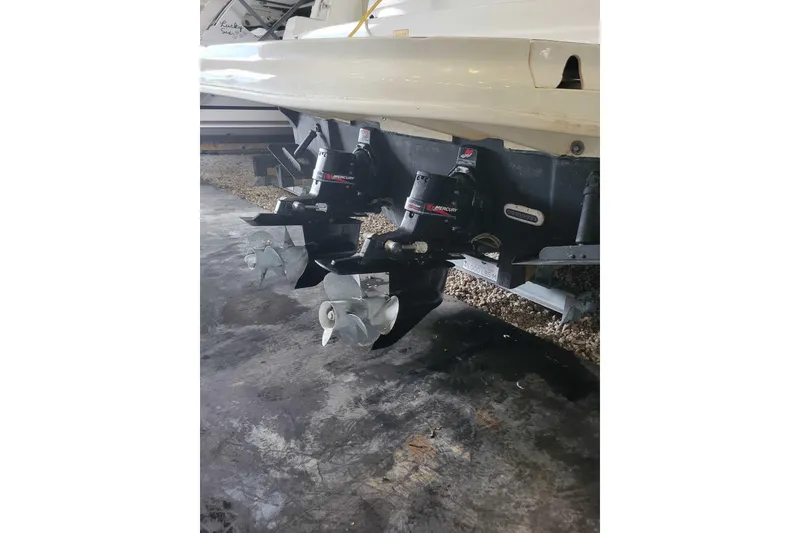 Slide: The Image of 2003 Sea Ray 320 Sundancer boat with dual Mercury outboard engines. - 12