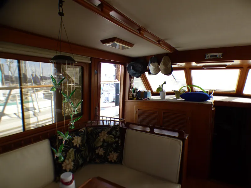 Slide: The Image of Interior of 1984 Spindrift 39 ft. Aft Cabin Twin Diesel yacht with cozy seating area. - 27