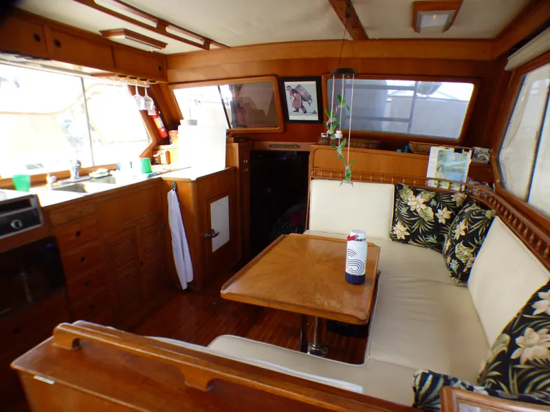 Slide: The Image of Interior of 1984 Spindrift 39 ft. Aft Cabin Twin Diesel yacht with cozy seating and kitchen. - 31
