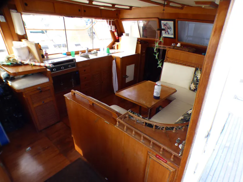 Slide: The Image of 1984 Spindrift 39 ft. Aft Cabin interior with wood finish and cozy seating area. - 32