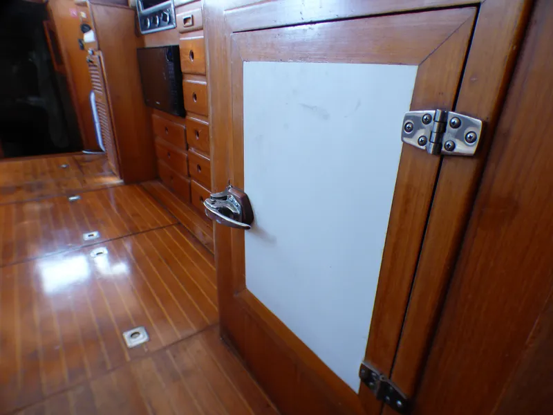 Slide: The Image of 1984 Spindrift 39 ft. Aft Cabin interior with wooden cabinetry and flooring. - 40