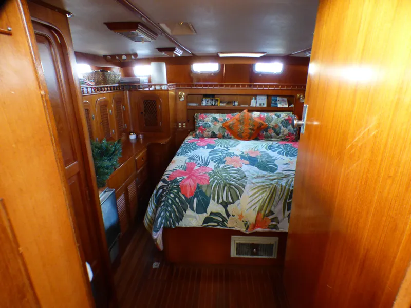 Slide: The Image of 1984 Spindrift 39 ft. aft cabin with floral bedding and wooden interior. - 43