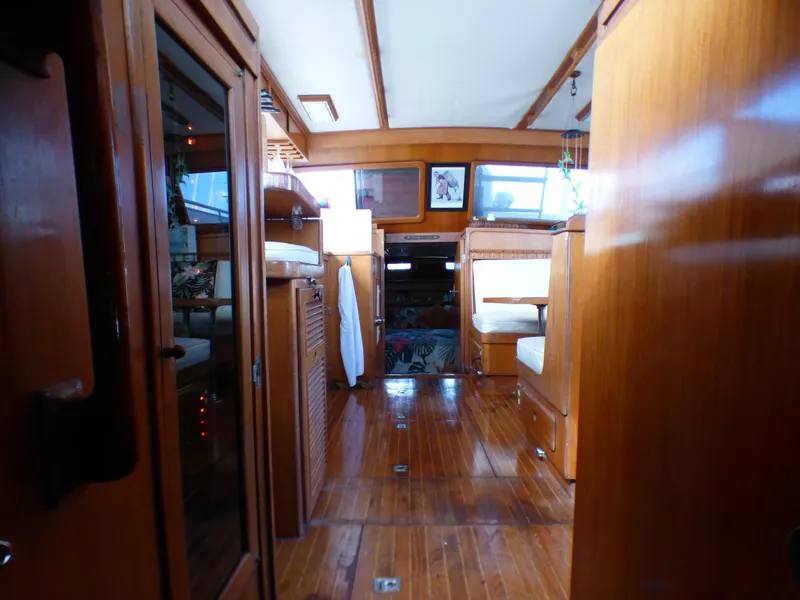 Slide: The Image of 1984 Spindrift 39 ft. Aft Cabin interior with polished wood and cozy seating. - 44