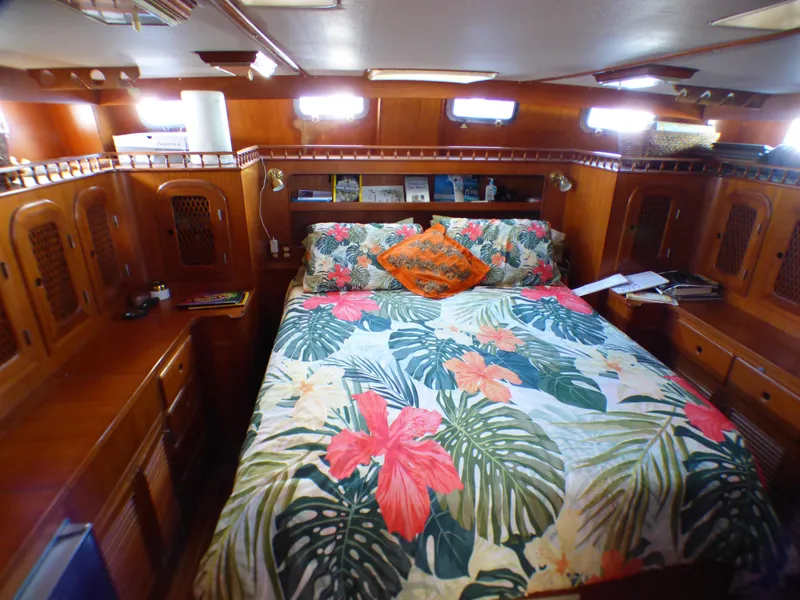 Slide: The Image of Cozy cabin interior of 1984 Spindrift 39 ft yacht with floral bedding and wooden furnishings. - 45