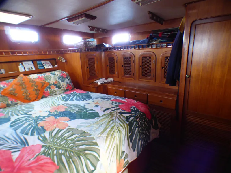 Slide: The Image of Cozy cabin interior of 1984 Spindrift 39 ft. yacht with floral bedding and wooden cabinetry. - 47