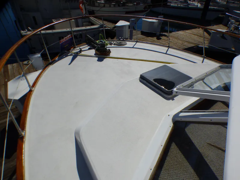 Slide: The Image of 1984 Spindrift 39 ft. Aft Cabin Twin Diesel boat deck with railing and hatch. - 7