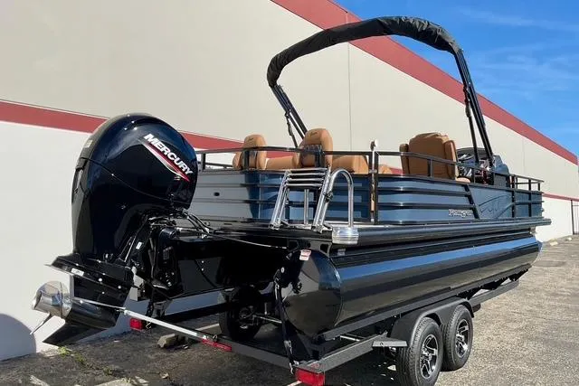 Slide: The Image of 2026 Ranger Reata 220F pontoon boat with Mercury engine on a trailer. - 4