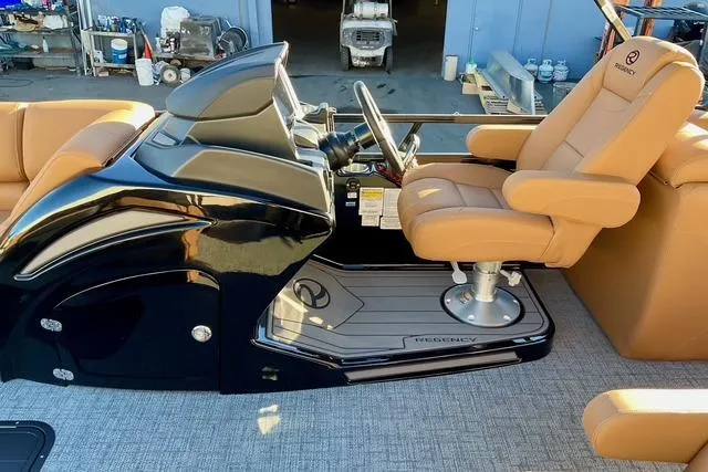 Slide: The Image of Luxurious 2026 Regency 250DL boat interior with sleek helm and comfortable seating. - 10