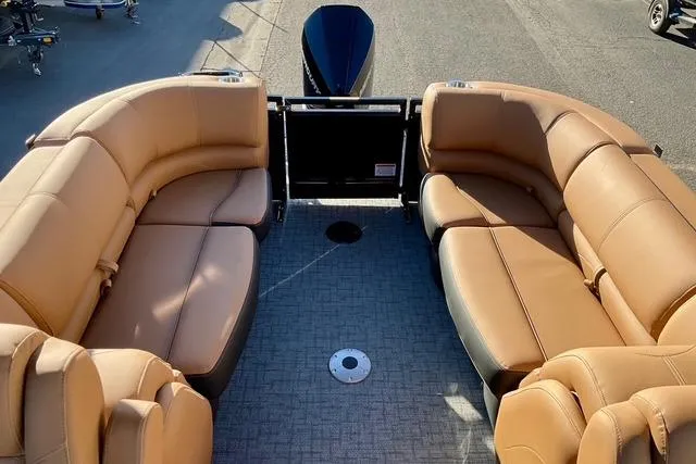 Slide: The Image of Luxurious 2026 Regency 250DL pontoon boat with spacious tan seating and modern design. - 8