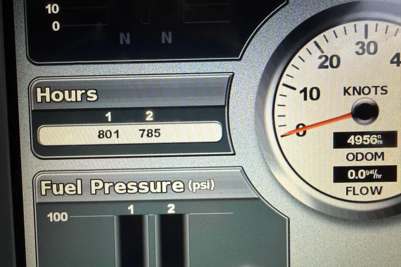 Slide: The Image of Dashboard of 1998 Davis Rock Harbor 25 showing hours, fuel pressure, and speed in knots. - 12