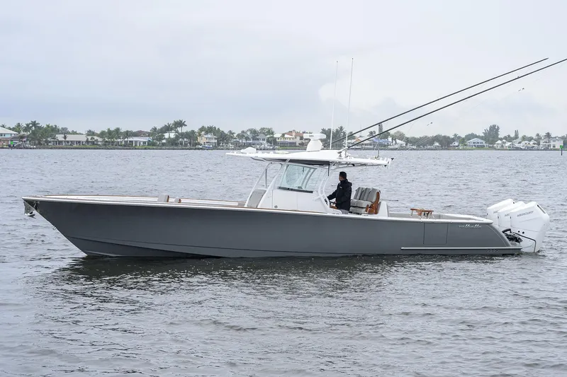 The Image of 2024 Valhalla Boatworks V-41 cruising on a calm waterway, side view. - 0