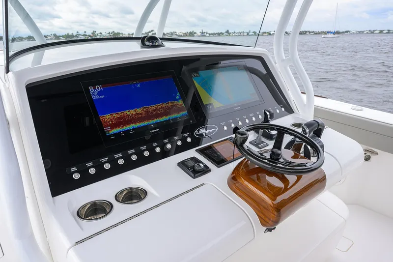 Slide: The Image of 2024 Valhalla Boatworks V-41 helm with advanced navigation displays and controls. - 10