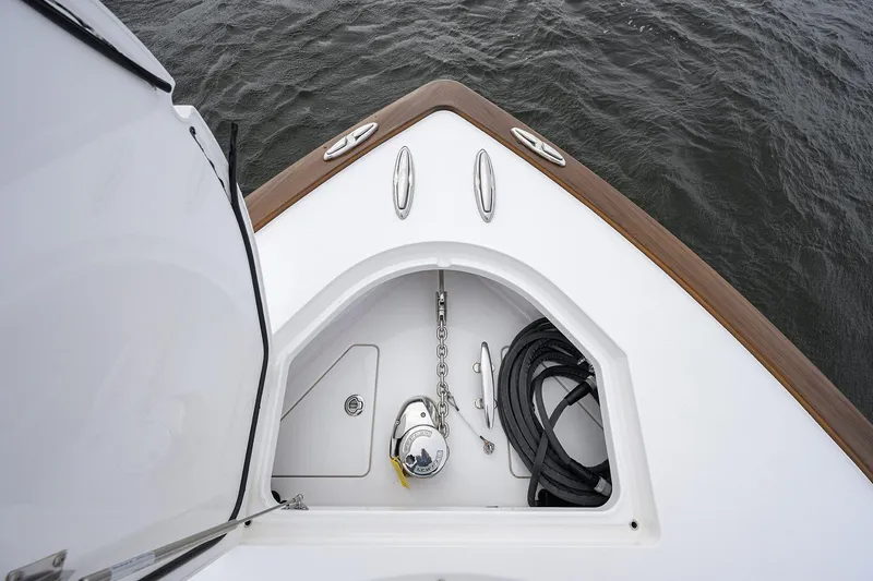 Slide: The Image of 2024 Valhalla Boatworks V-41 bow storage with anchor and rope, on water. - 15