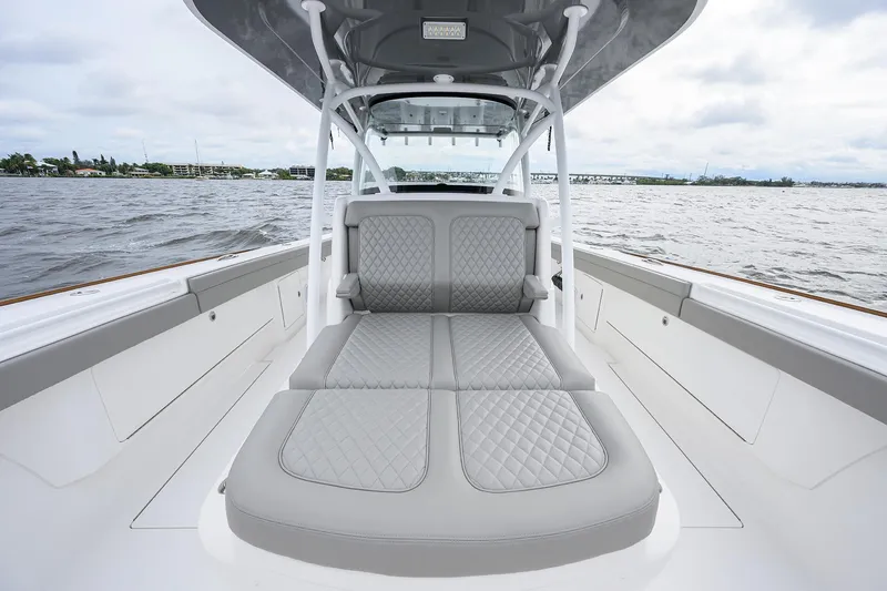Slide: The Image of 2024 Valhalla Boatworks V-41 interior with luxurious seating on open water. - 17