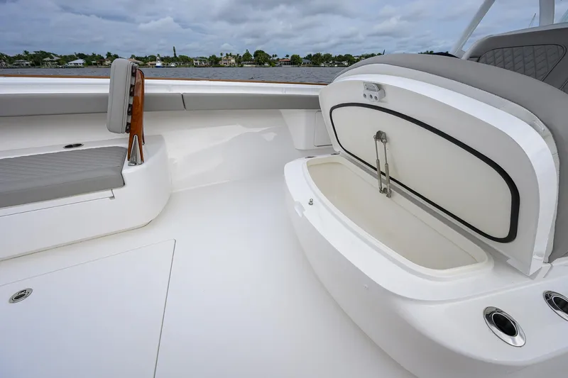 Slide: The Image of 2024 Valhalla Boatworks V-41 interior with open storage compartment and seating. - 18