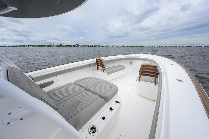 Slide: The Image of 2024 Valhalla Boatworks V-41, luxurious seating, open water view, sleek design. - 19