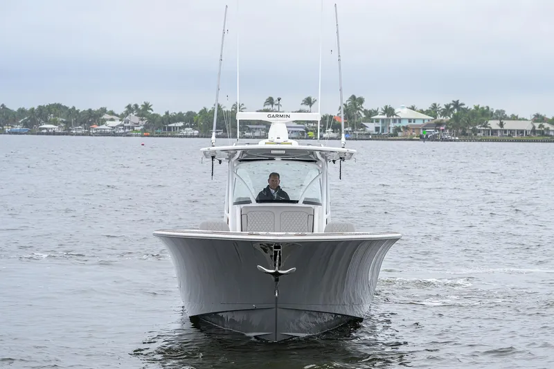 Slide: The Image of 2024 Valhalla Boatworks V-41 cruising on a calm waterway, front view. - 2