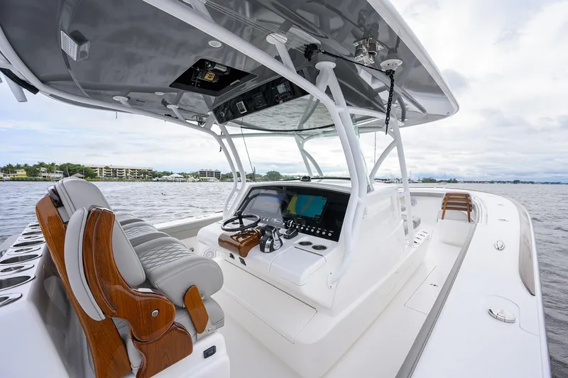 Slide: The Image of 2024 Valhalla Boatworks V-41 interior with modern helm and luxurious seating on the water. - 20