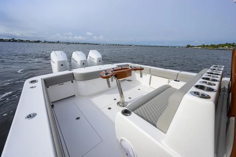Slide: The Image of 2024 Valhalla Boatworks V-41, spacious deck with seating and multiple outboard engines. - 22