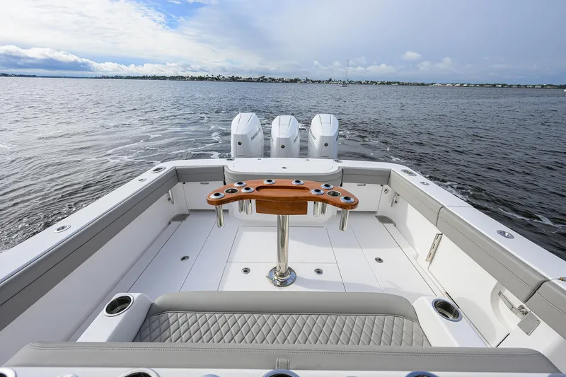 Slide: The Image of 2024 Valhalla Boatworks V-41, spacious deck with triple engines on open water. - 23