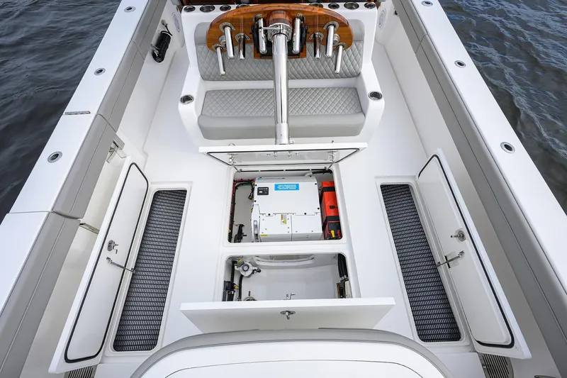 Slide: The Image of 2024 Valhalla Boatworks V-41 interior with open storage compartments and seating. - 28