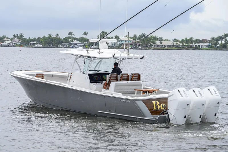 Slide: The Image of 2024 Valhalla Boatworks V-41 on water, featuring triple outboard engines. - 7