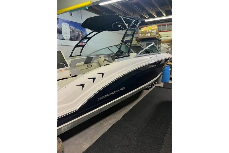 The Image of 2020 Chaparral 23 SSi boat in showroom, featuring sleek design and modern features. - 0