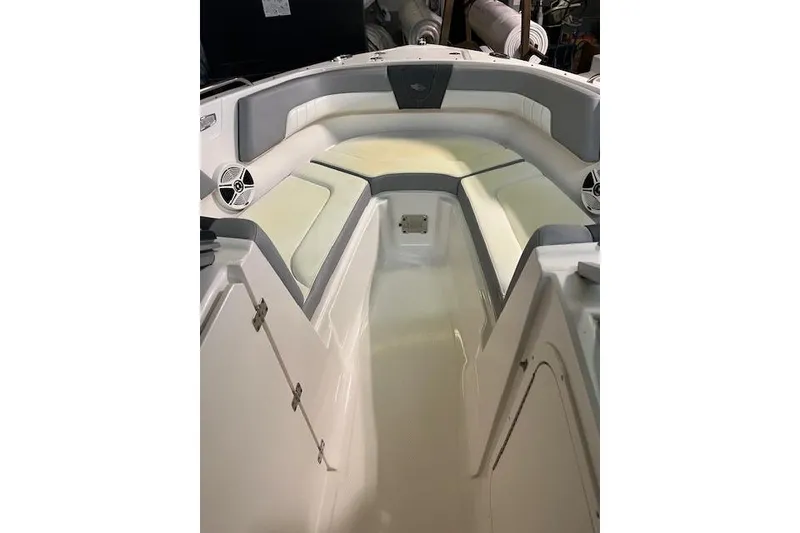 Slide: The Image of 2020 Chaparral 23 SSi boat interior with cushioned seating and speakers. - 4
