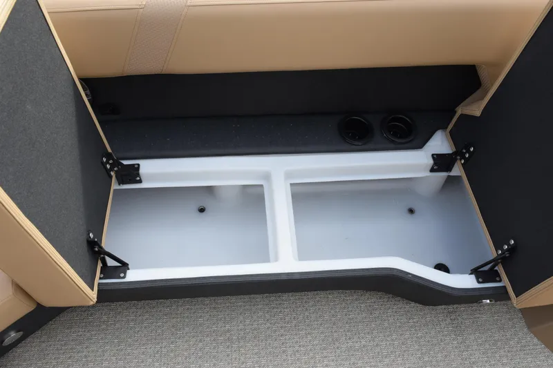 Slide: The Image of Open storage compartment in 2026 Evotti 525QL boat with beige seating. - 20