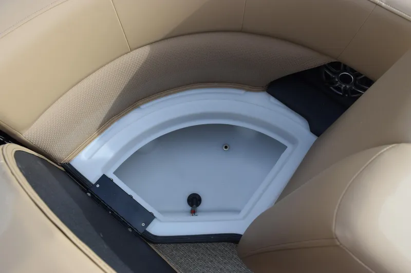 Slide: The Image of Evotti 525QL 2026 boat interior with beige seating and storage compartment. - 21