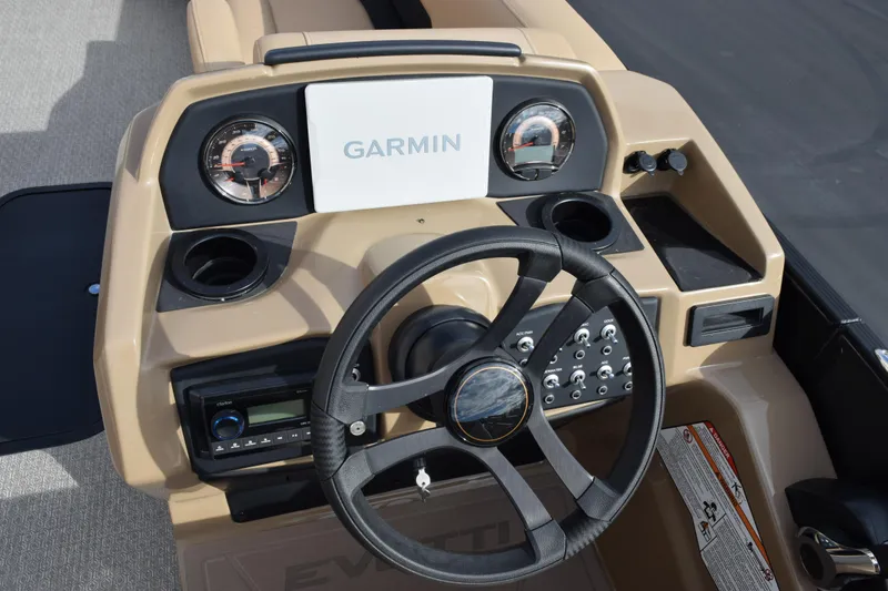 Slide: The Image of Cockpit of 2026 Evotti 525QL boat with Garmin navigation system and steering wheel. - 25