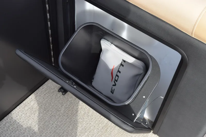 Slide: The Image of Evotti 525QL 2026 model storage compartment with branded bag inside. - 28