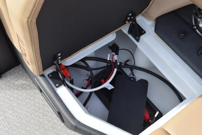 Slide: The Image of Open storage compartment in 2026 Evotti 525QL boat, showing wiring and components. - 29
