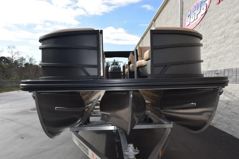 Slide: The Image of 2026 Evotti 525QL pontoon boat on trailer, outdoor display. - 3