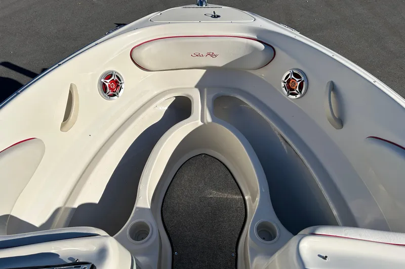 Slide: The Image of 2010 Sea Ray 205 Sport boat interior with speakers and seating. - 15