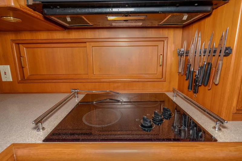 Slide: The Image of Galley kitchen in 2001 Fleming 55 Pilothouse with stove and knife rack. - 20