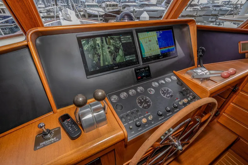 Slide: The Image of Pilothouse of 2001 Fleming 55 yacht with navigation controls and dual screens. - 29