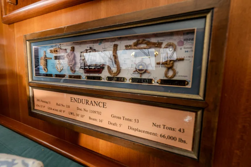 Slide: The Image of Plaque displaying 2001 Fleming 55 Pilothouse yacht details and nautical knots. - 31