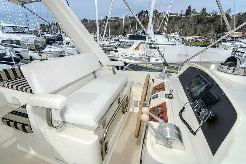 Slide: The Image of Pilothouse of 2001 Fleming 55 yacht with steering wheel and navigation equipment. - 36