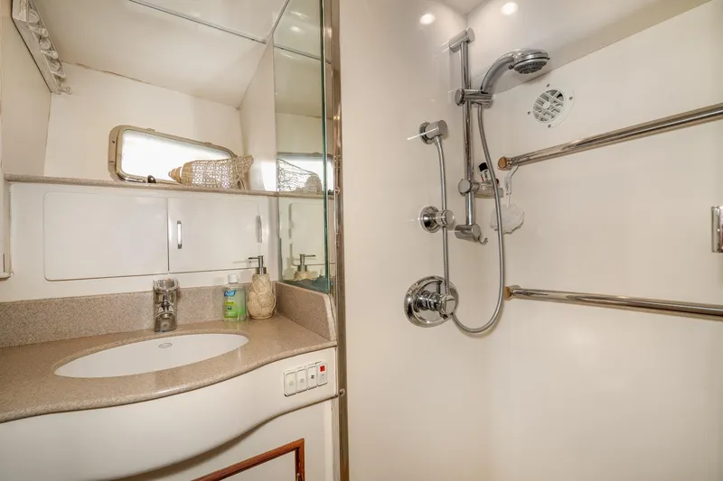 Slide: The Image of Bathroom interior of 2001 Fleming 55 Pilothouse yacht, featuring sink and shower. - 61