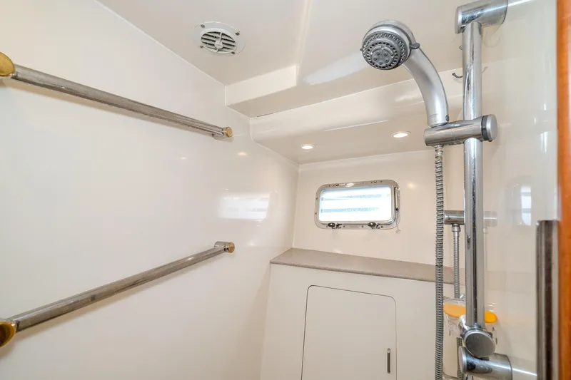 Slide: The Image of Shower area in 2001 Fleming 55 Pilothouse yacht with window and chrome fixtures. - 72