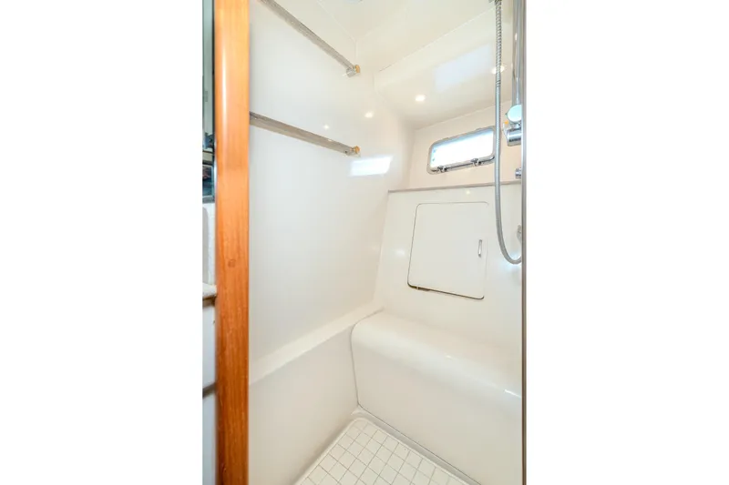 Slide: The Image of Shower area in 2001 Fleming 55 Pilothouse yacht, featuring sleek white design and modern fixtures. - 73