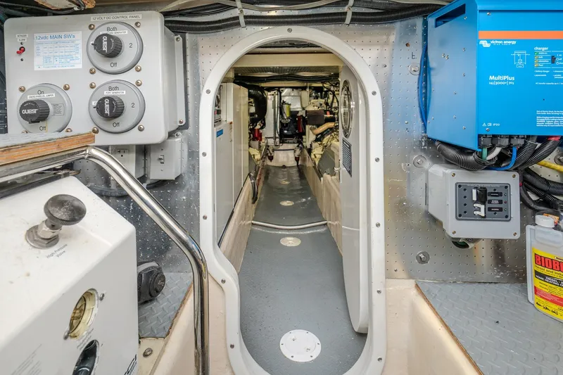 Slide: The Image of Engine room of 2001 Fleming 55 Pilothouse yacht, featuring control panels and equipment. - 88