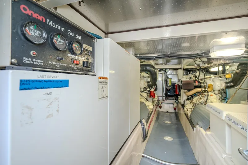 Slide: The Image of Engine room of a 2001 Fleming 55 Pilothouse with Onan Marine Genset. - 90