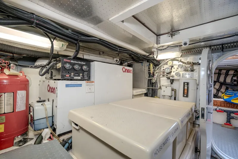 Slide: The Image of Engine room of 2001 Fleming 55 Pilothouse with Onan Marine GenSet and equipment. - 93