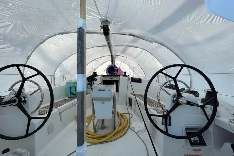 Slide: The Image of Interior view of a 2014 Jeanneau Sun Odyssey 439 sailboat under protective cover. - 14