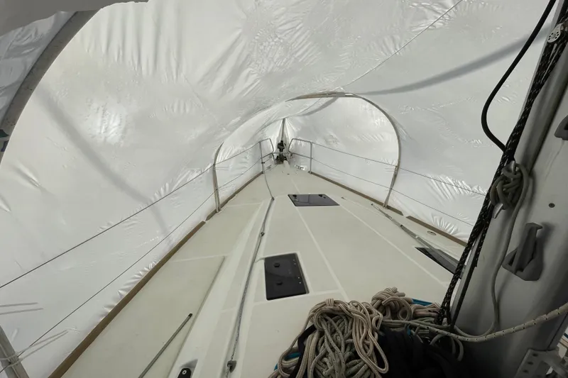 Slide: The Image of 2014 Jeanneau Sun Odyssey 439 sailboat deck under protective cover. - 17