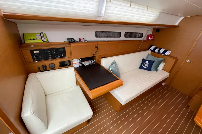 Slide: The Image of Interior of 2014 Jeanneau Sun Odyssey 439 yacht with cozy seating and navigation panel. - 22