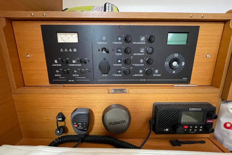 Slide: The Image of Control panel of a 2014 Jeanneau Sun Odyssey 439 sailboat with navigation and communication equipment. - 23