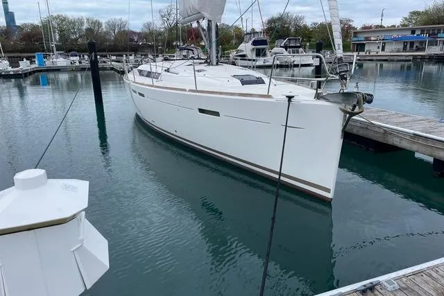Slide: The Image of 2014 Jeanneau Sun Odyssey 439 sailboat docked in a marina. - 4